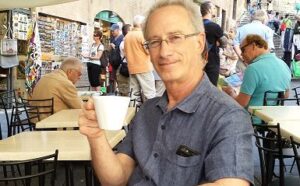 Savoring and listening with Bob at a cafe in Siena, Italy